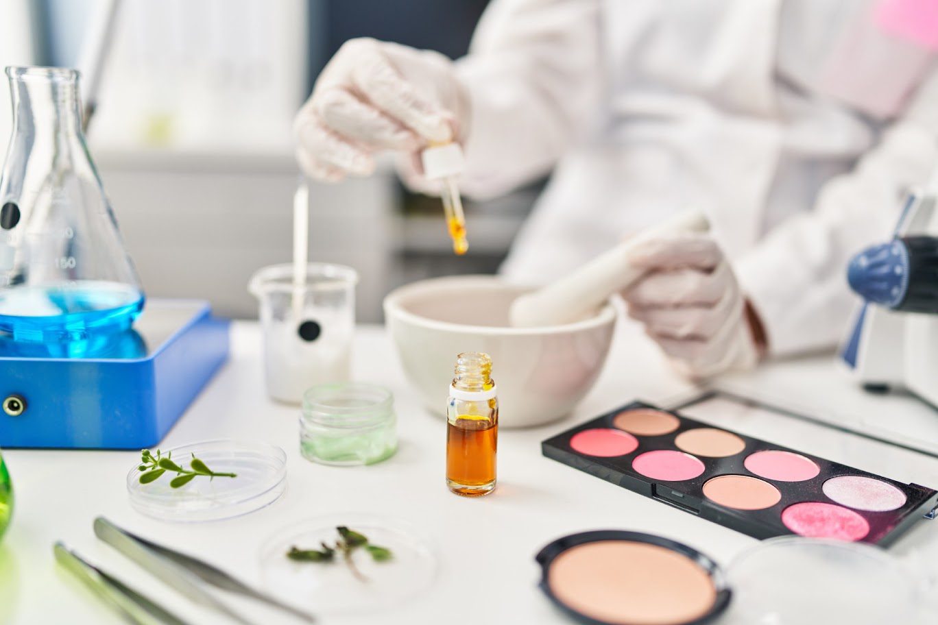Scientist mixing cosmetics in a laboratory.